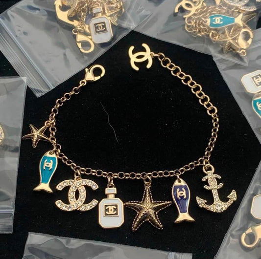 Gold Tone Nautical Ocean Charm Bracelet