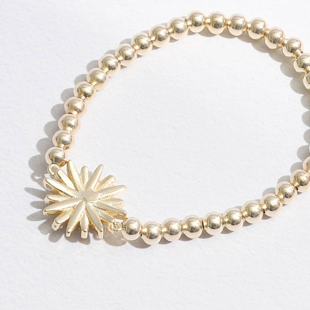 Gold Tone Starburst Charm Beaded Bracelet