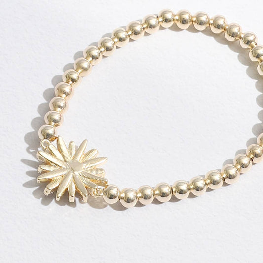 Gold Tone Starburst Charm Beaded Bracelet