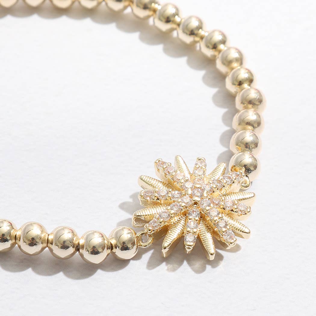 Gold Tone Starburst Charm Beaded Bracelet