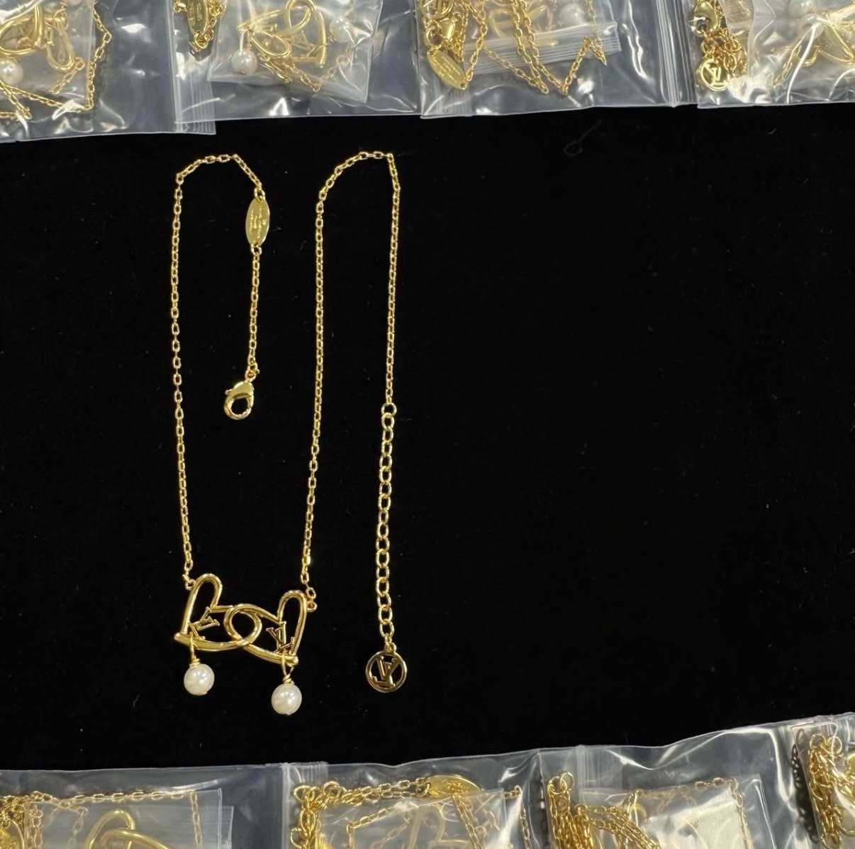 Gold-Tone Interlocking Hearts Pendant Necklace with Pearl Accents